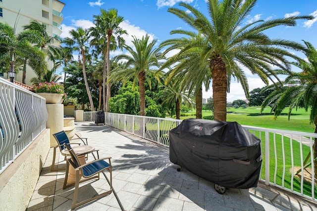 view of patio / terrace with area for grilling and a balcony