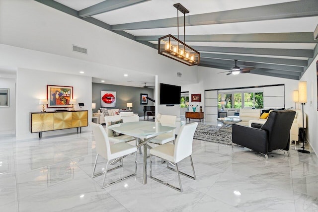 dining space with ceiling fan and lofted ceiling with beams