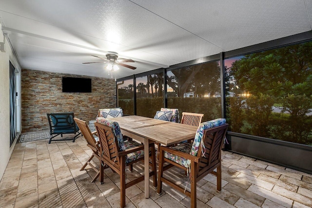 sunroom / solarium with ceiling fan