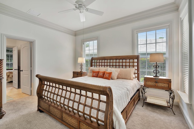 bedroom featuring ceiling fan, visible vents, crown molding, and light colored carpet