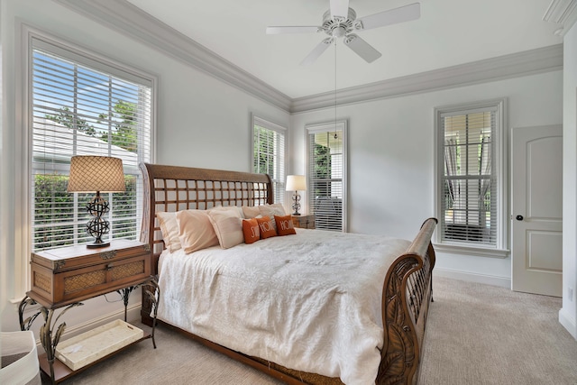 carpeted bedroom featuring ceiling fan, multiple windows, and crown molding