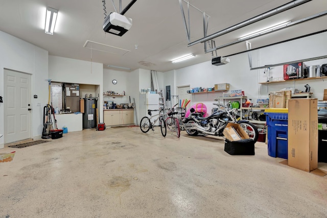 garage with freestanding refrigerator, electric panel, electric water heater, and a garage door opener