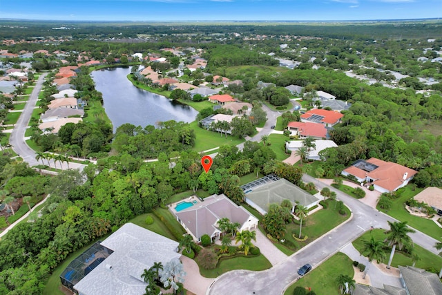 drone / aerial view featuring a residential view and a water view