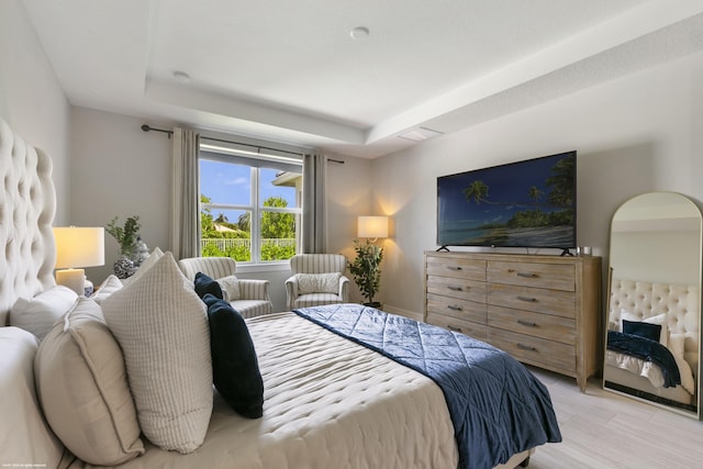 bedroom with a tray ceiling