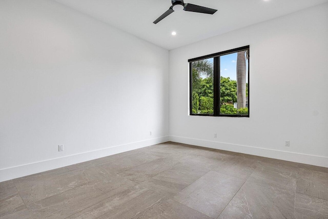 spare room featuring a ceiling fan, baseboards, and recessed lighting