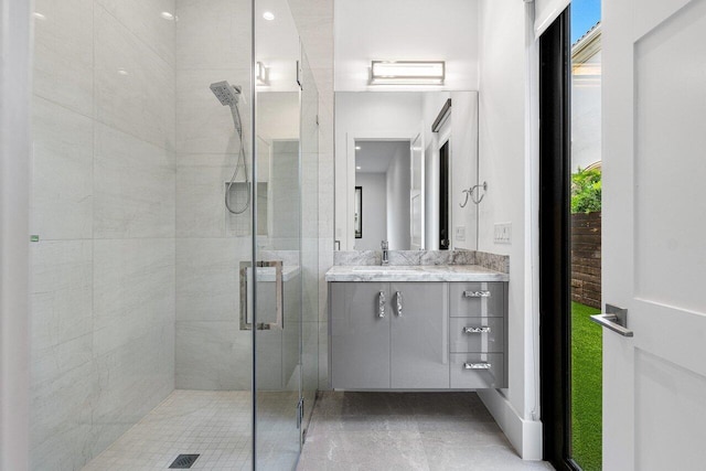 bathroom with vanity and walk in shower