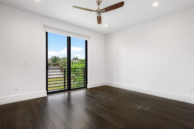 unfurnished room featuring ceiling fan and dark hardwood / wood-style flooring