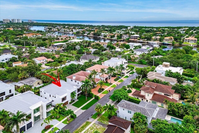 bird's eye view featuring a residential view and a water view