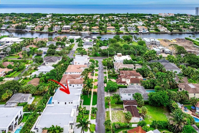 bird's eye view featuring a residential view and a water view