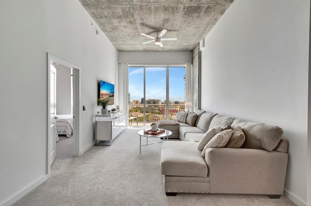 living room featuring ceiling fan and light carpet