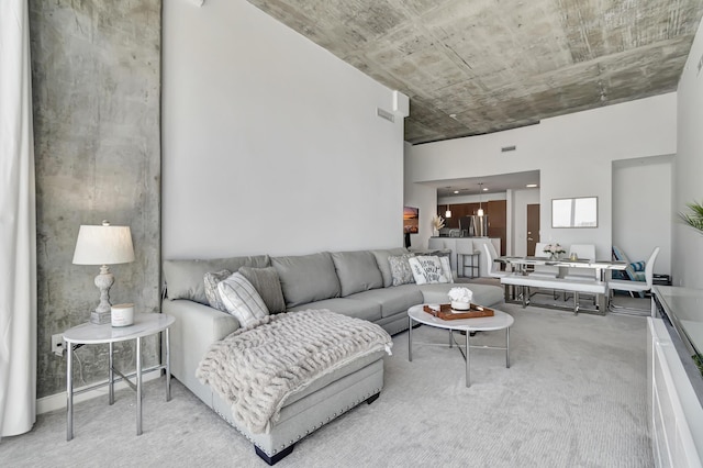 living area with light colored carpet