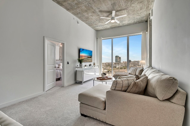 living room featuring ceiling fan and light colored carpet