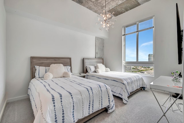 carpeted bedroom with a chandelier