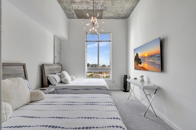 bedroom with carpet flooring, baseboards, and an inviting chandelier