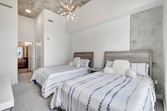 bedroom featuring visible vents, carpet flooring, an inviting chandelier, and a towering ceiling