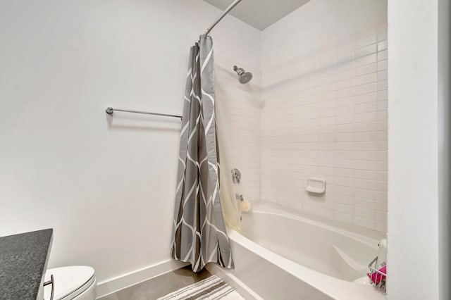 full bathroom featuring tile patterned flooring, vanity, shower / tub combo, and toilet