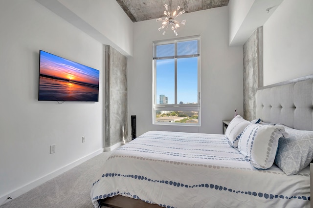 carpeted bedroom featuring a notable chandelier