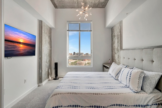 bedroom featuring carpet floors and a chandelier