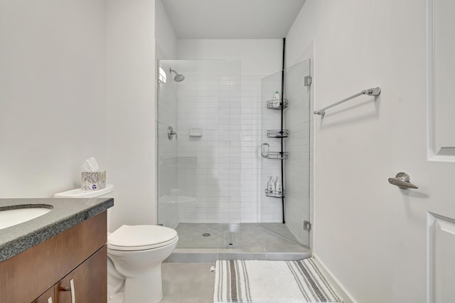 full bathroom featuring vanity, toilet, and a stall shower