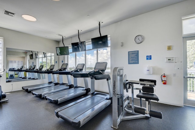 workout area with visible vents and baseboards