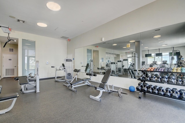 gym featuring visible vents and baseboards