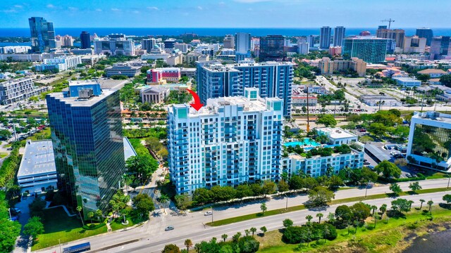 drone / aerial view featuring a water view and a city view