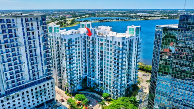 birds eye view of property with a water view