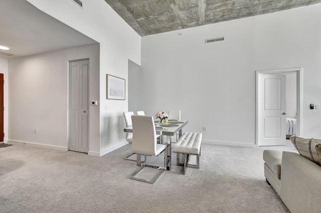 dining room featuring visible vents, carpet flooring, and baseboards