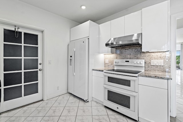 kitchen with range hood, white appliances, light stone counters, white cabinetry, and decorative backsplash