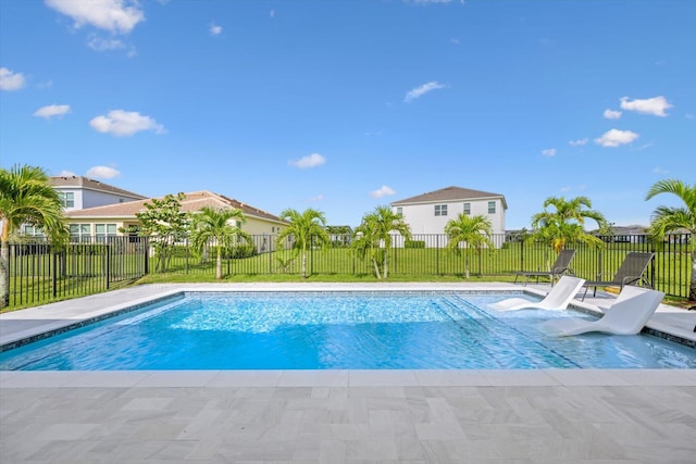 view of pool with a lawn