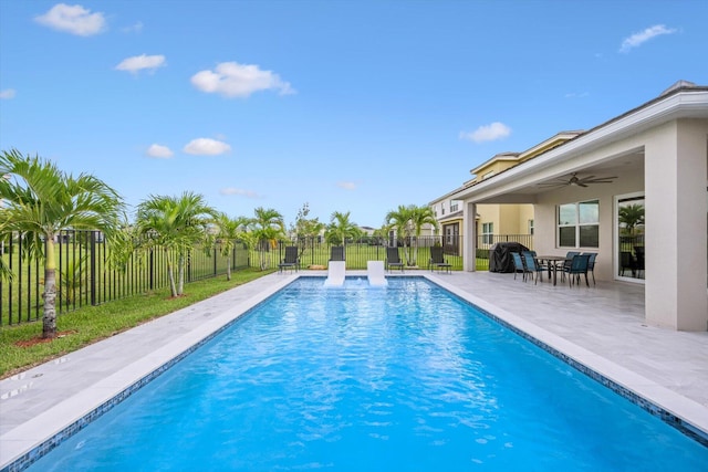 view of pool featuring ceiling fan and a patio