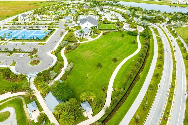 birds eye view of property with a water view