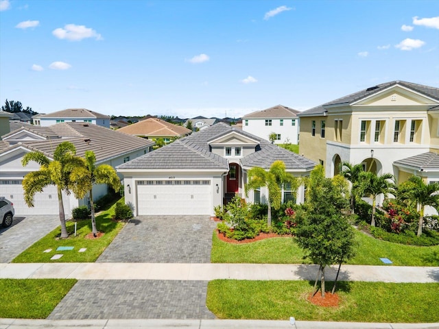 view of front of house with a garage and a front yard