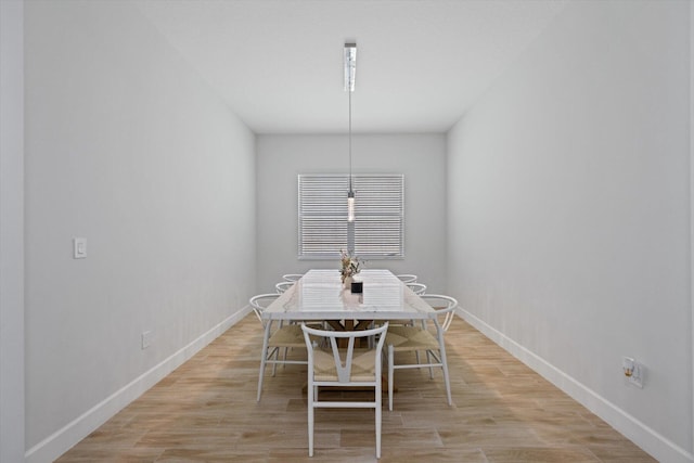 unfurnished dining area featuring light wood-type flooring