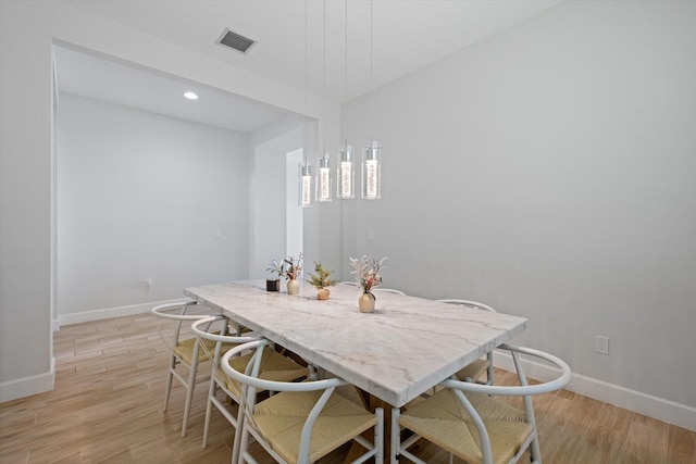 dining room with light hardwood / wood-style floors