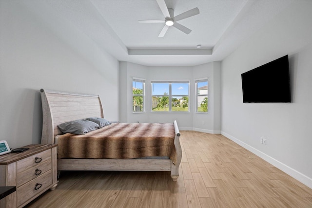 bedroom featuring ceiling fan and light hardwood / wood-style floors