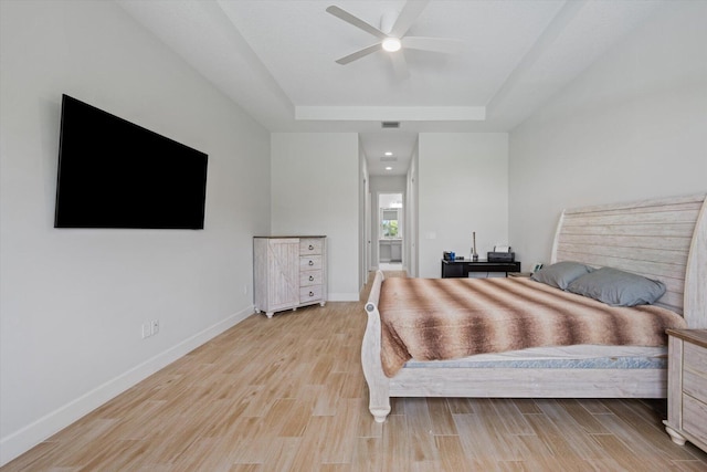 bedroom with ceiling fan and light hardwood / wood-style flooring