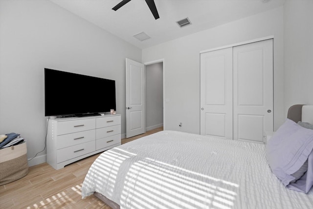 bedroom with ceiling fan and a closet