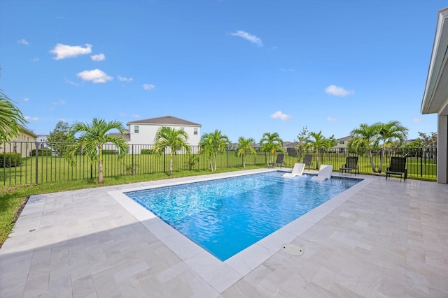 view of swimming pool with a patio area