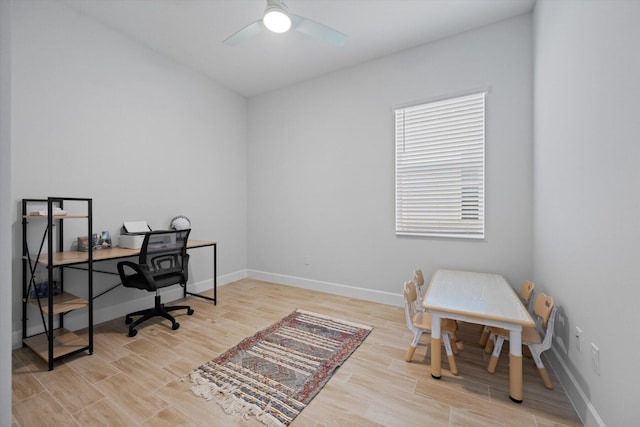 office space featuring light hardwood / wood-style floors and ceiling fan