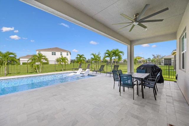 view of pool featuring ceiling fan, area for grilling, a lawn, and a patio