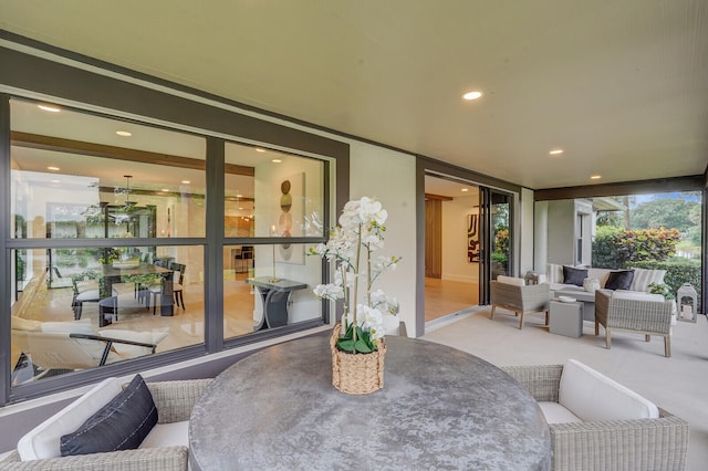 carpeted living room with a wall of windows