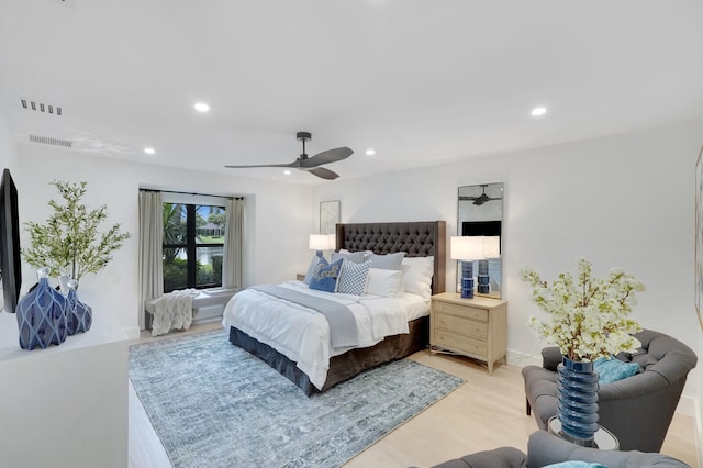 bedroom featuring light hardwood / wood-style flooring and ceiling fan