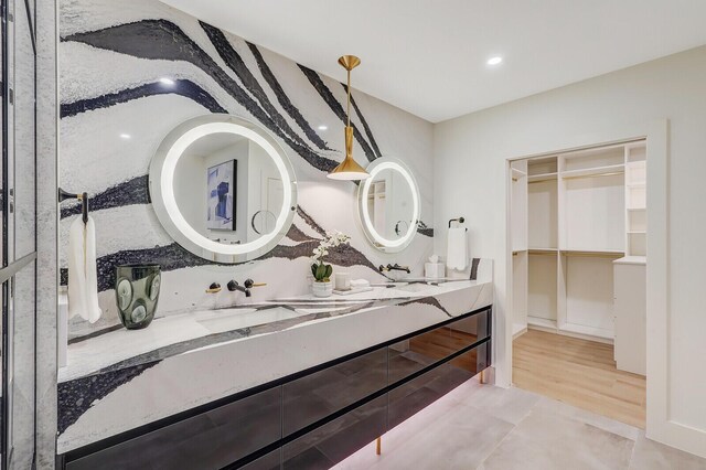 bathroom featuring hardwood / wood-style flooring and vanity