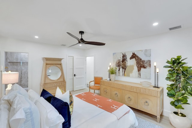 bedroom with light hardwood / wood-style flooring and ceiling fan