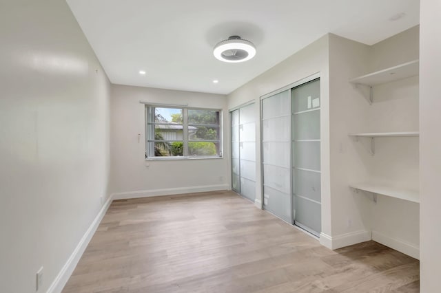 unfurnished bedroom featuring light hardwood / wood-style floors