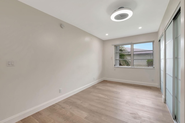 spare room with light hardwood / wood-style floors