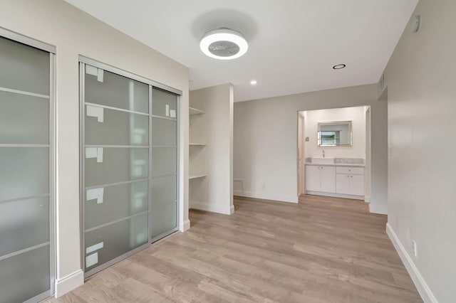 interior space featuring light hardwood / wood-style floors and sink