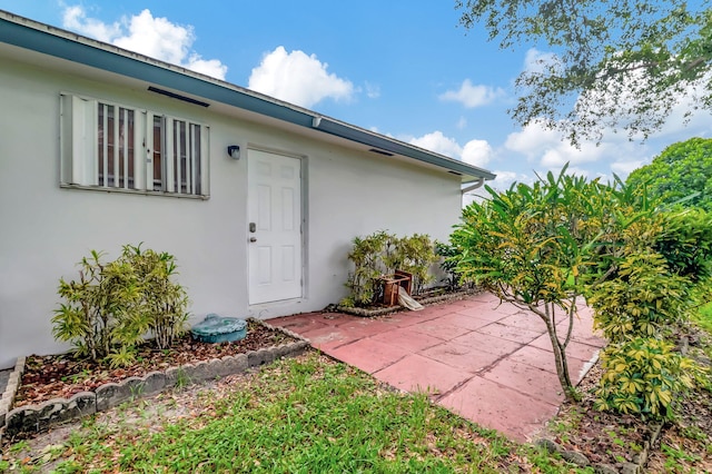 property entrance with a patio area