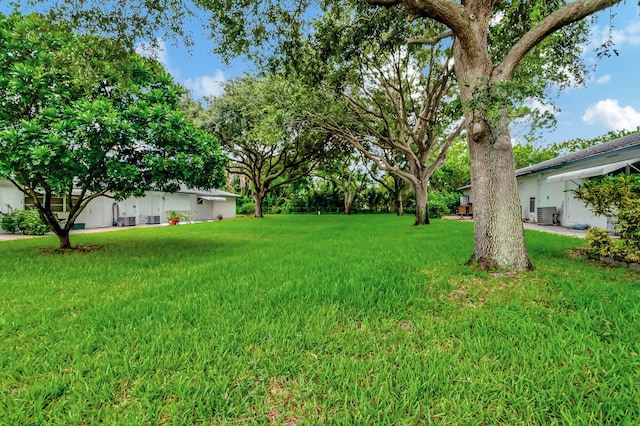 view of yard with central AC